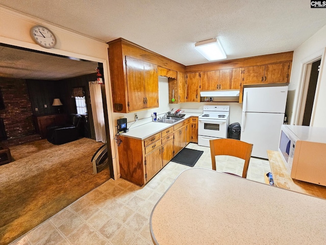 2514 Sheryl Ln, Columbia, SC 29204 - kitchen featuring white appliances, range hood, brown cabinetry, light countertops, and a textured ceiling