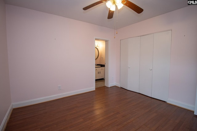 619 King St Unit 801, Columbia, SC 29205 - unfurnished bedroom featuring dark wood-style flooring, a closet, connected bathroom, and a ceiling fan