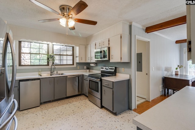 9628 Highgate Rd, Columbia, SC 29223 - kitchen with stainless steel appliances, a textured ceiling, ornamental molding, light countertops, and a ceiling fan