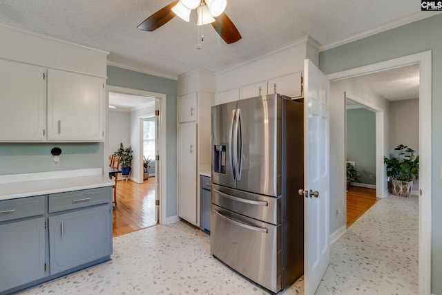 9628 Highgate Rd, Columbia, SC 29223 - kitchen featuring stainless steel refrigerator with ice dispenser, ceiling fan, crown molding, light countertops, and a textured ceiling