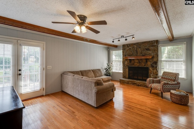 9628 Highgate Rd, Columbia, SC 29223 - living room with light wood-type flooring, a textured ceiling, plenty of natural light, ceiling fan, and french doors