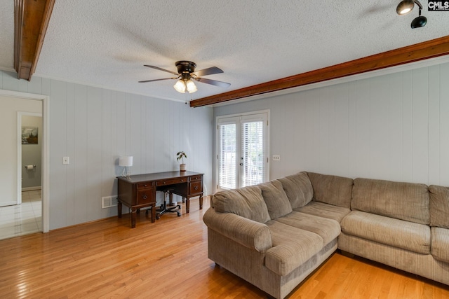 9628 Highgate Rd, Columbia, SC 29223 - living room featuring french doors, light wood finished floors, ceiling fan, a textured ceiling, and beam ceiling