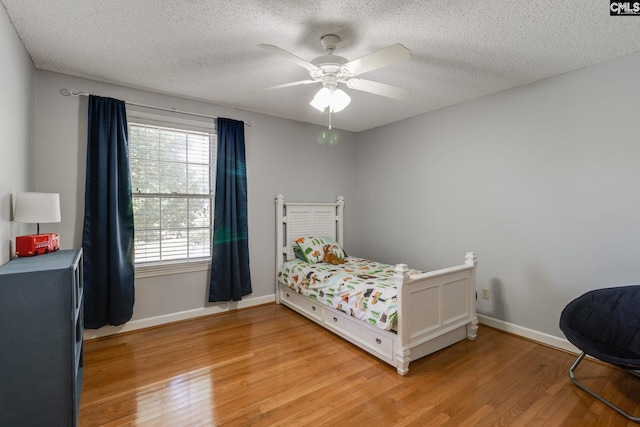 9628 Highgate Rd, Columbia, SC 29223 - bedroom featuring light wood finished floors, a textured ceiling, and ceiling fan