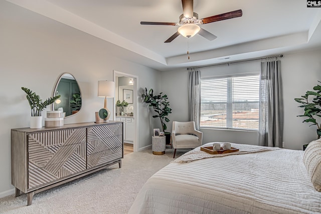 2095 County Line Trl, Elgin, SC 29045 - bedroom with light colored carpet, a raised ceiling, ensuite bath, and ceiling fan