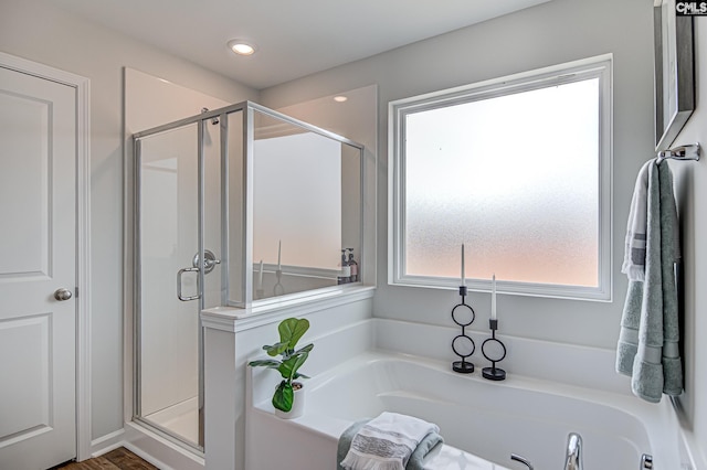 2095 County Line Trl, Elgin, SC 29045 - full bathroom with a stall shower, a bath, recessed lighting, and wood finished floors