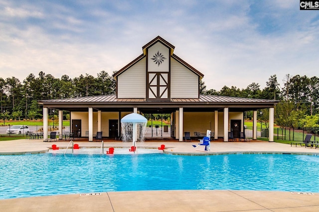2095 County Line Trl, Elgin, SC 29045 - community pool with a patio and view of wooded area