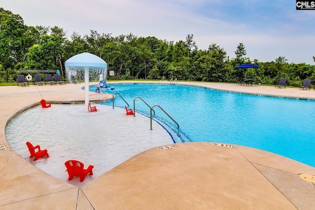 2095 County Line Trl, Elgin, SC 29045 - community pool featuring a patio and view of scattered trees