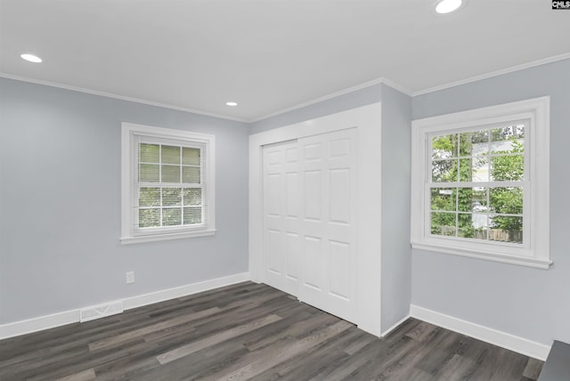 3619 Hanson Ave, Columbia, SC 29204 - unfurnished bedroom featuring crown molding, a closet, dark wood-type flooring, and recessed lighting