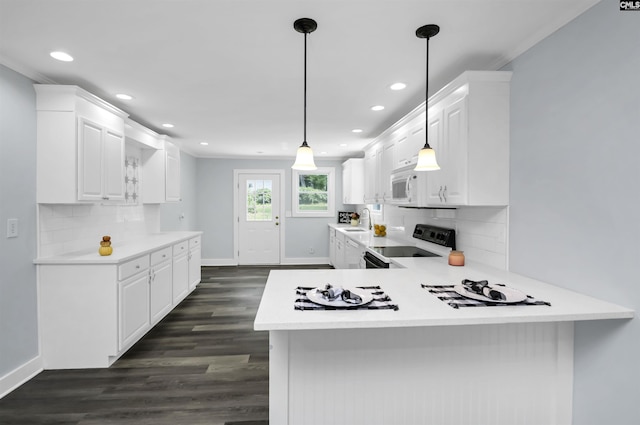 3619 Hanson Ave, Columbia, SC 29204 - kitchen featuring range with electric cooktop, light countertops, white cabinets, dark wood finished floors, and recessed lighting