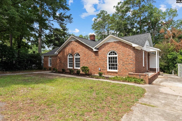 4405 Palmetto Ave, Columbia, SC 29203 - single story home with brick siding, a front lawn, a chimney, a shingled roof, and driveway