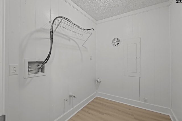 4405 Palmetto Ave, Columbia, SC 29203 - washroom featuring hookup for a gas dryer, washer hookup, light wood-style flooring, electric panel, and a textured ceiling