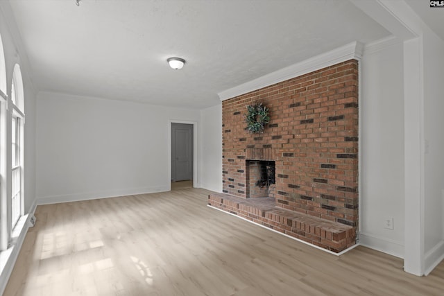 4405 Palmetto Ave, Columbia, SC 29203 - unfurnished living room featuring wood finished floors, ornamental molding, and a fireplace