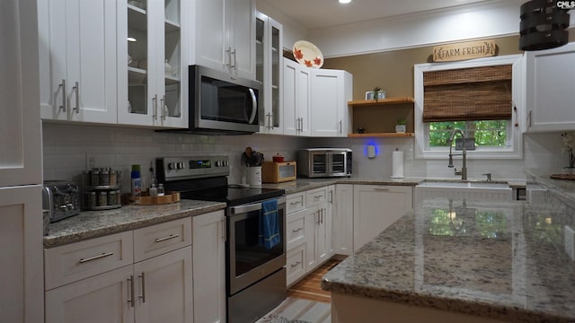 2367 Mount Pilgrim Church Rd, Prosperity, SC 29127 - kitchen with stainless steel appliances and white cabinetry