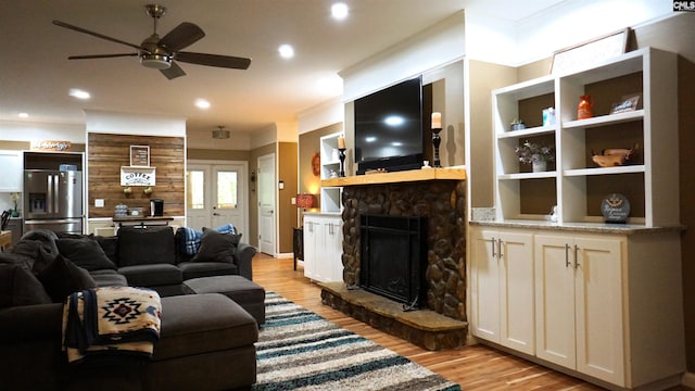 2367 Mount Pilgrim Church Rd, Prosperity, SC 29127 - living room featuring ceiling fan, light wood finished floors, a stone fireplace, and recessed lighting