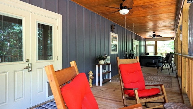 2367 Mount Pilgrim Church Rd, Prosperity, SC 29127 - sunroom / solarium featuring a ceiling fan, outdoor dining area, wood finished floors, wooden ceiling, and a wooden deck