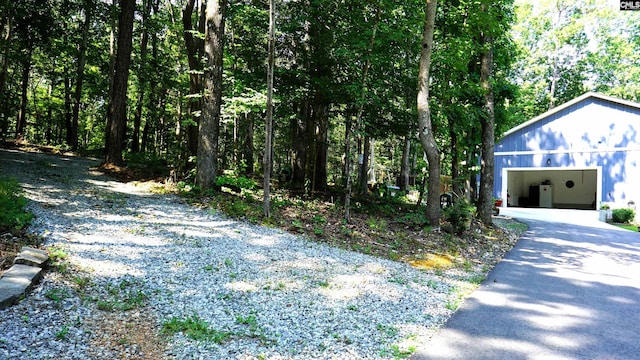 2367 Mount Pilgrim Church Rd, Prosperity, SC 29127 - view of yard featuring a garage and asphalt driveway