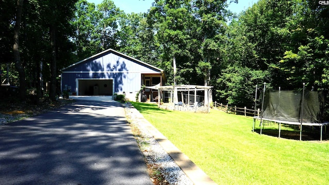2367 Mount Pilgrim Church Rd, Prosperity, SC 29127 - view of front facade with a trampoline, a detached garage, and asphalt driveway