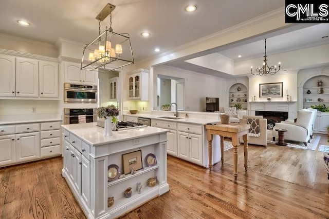 426 Turkey Point Cir, Columbia, SC 29223 - kitchen with a chandelier, ornamental molding, white cabinetry, open floor plan, and light countertops