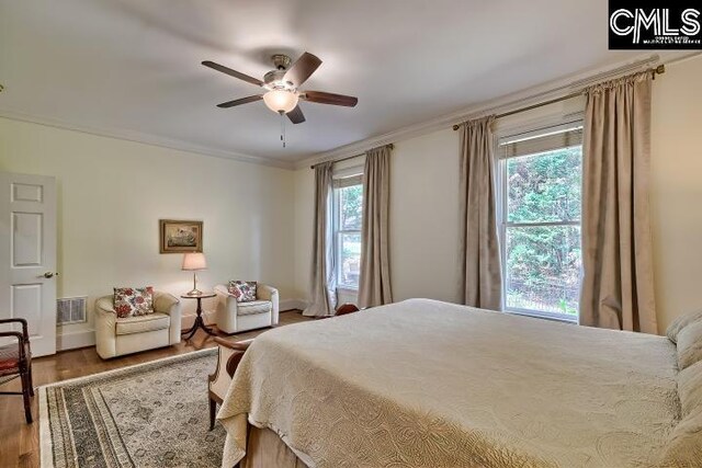 426 Turkey Point Cir, Columbia, SC 29223 - bedroom with wood finished floors, ornamental molding, and a ceiling fan