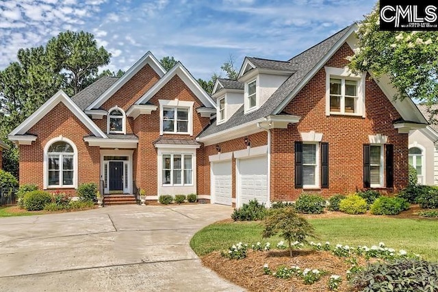 426 Turkey Point Cir, Columbia, SC 29223 - view of front of house featuring brick siding, driveway, a garage, roof with shingles, and a front yard