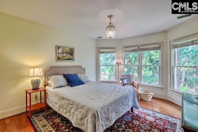 426 Turkey Point Cir, Columbia, SC 29223 - bedroom featuring crown molding, multiple windows, and wood finished floors