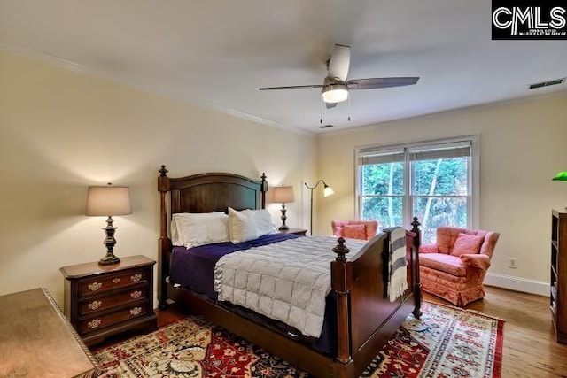 426 Turkey Point Cir, Columbia, SC 29223 - bedroom with wood finished floors, crown molding, and ceiling fan