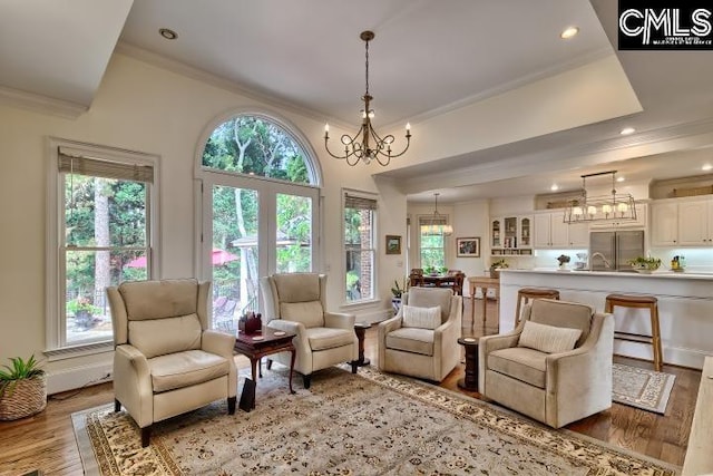 426 Turkey Point Cir, Columbia, SC 29223 - living room featuring a chandelier, crown molding, plenty of natural light, light wood finished floors, and recessed lighting