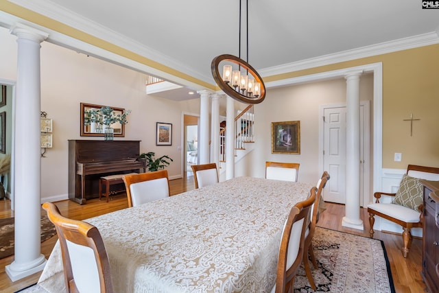 132 Alston Cir, Lexington, SC 29072 - dining room with crown molding, light wood-type flooring, stairs, and ornate columns