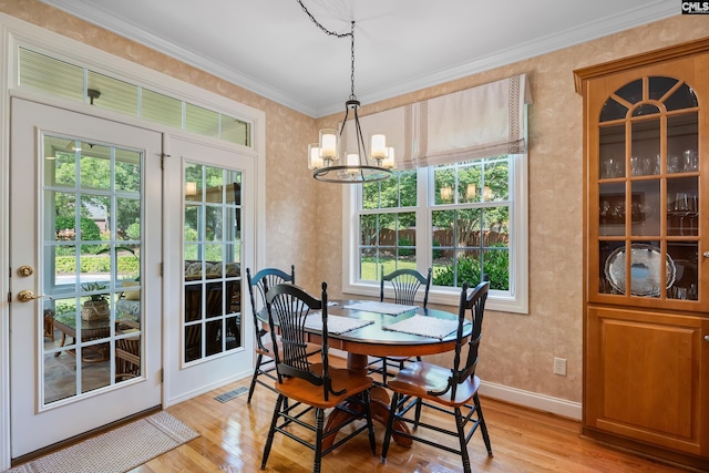 132 Alston Cir, Lexington, SC 29072 - dining area featuring light wood-style flooring, a chandelier, and crown molding
