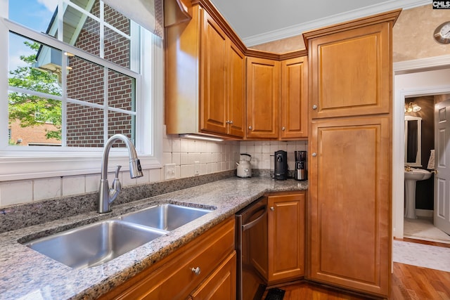 132 Alston Cir, Lexington, SC 29072 - kitchen featuring dishwasher, decorative backsplash, wood finished floors, crown molding, and light stone countertops