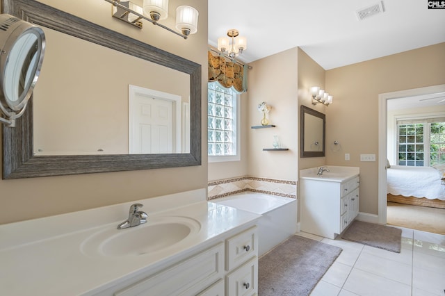 132 Alston Cir, Lexington, SC 29072 - ensuite bathroom with two vanities, a garden tub, and tile patterned floors