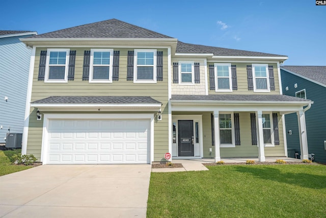 4040 Summerland Way, Elgin, SC 29045 - view of front of home with a porch, driveway, a front yard, an attached garage, and a shingled roof