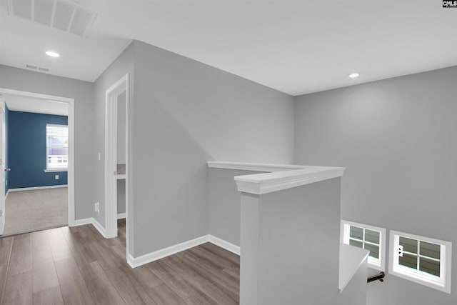 4040 Summerland Way, Elgin, SC 29045 - hall with an upstairs landing, wood finished floors, and recessed lighting