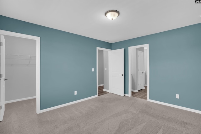 4040 Summerland Way, Elgin, SC 29045 - unfurnished bedroom with carpet, a spacious closet, and a closet