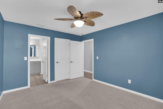 4040 Summerland Way, Elgin, SC 29045 - unfurnished bedroom with carpet, ensuite bath, and a ceiling fan