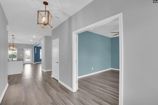 4040 Summerland Way, Elgin, SC 29045 - corridor with a chandelier, wood finished floors, and recessed lighting