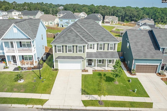 4040 Summerland Way, Elgin, SC 29045 - view of front of property featuring covered porch, concrete driveway, a residential view, and a shingled roof
