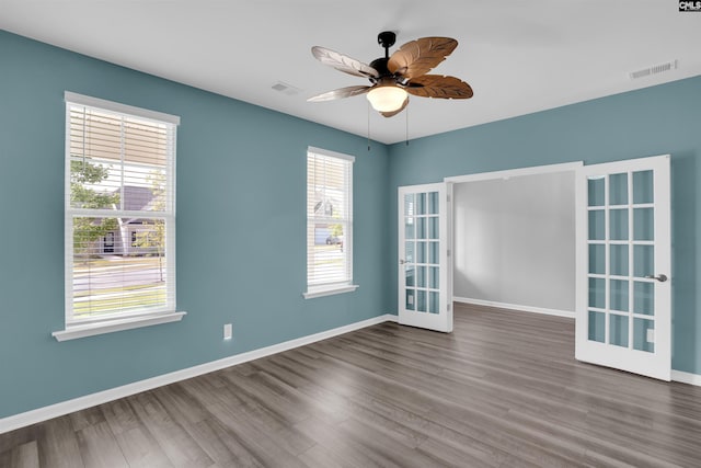 4040 Summerland Way, Elgin, SC 29045 - empty room featuring french doors, wood finished floors, and ceiling fan
