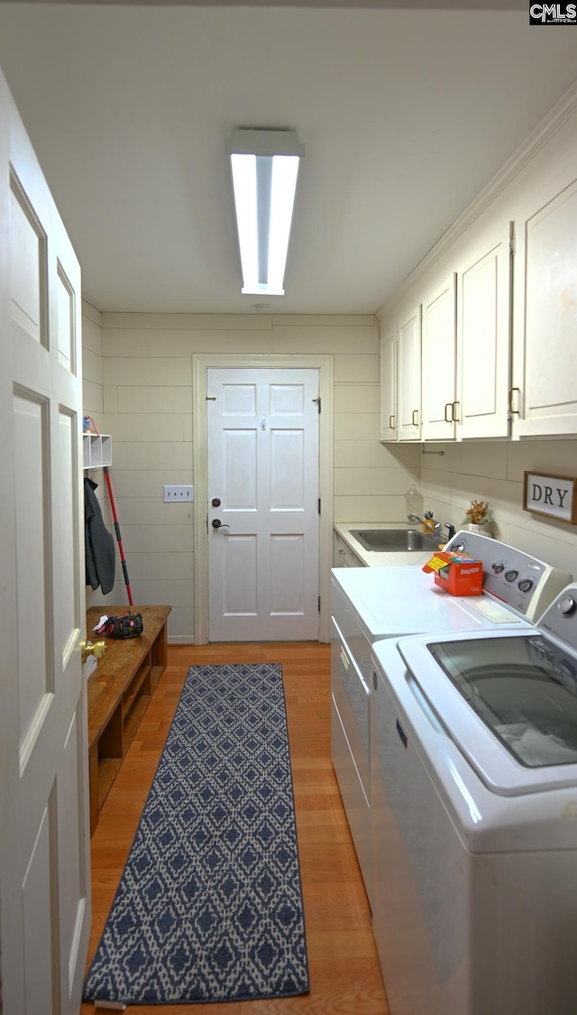 77 Olde Springs Rd, Columbia, SC 29223 - laundry room featuring washer and dryer, cabinet space, and light wood finished floors