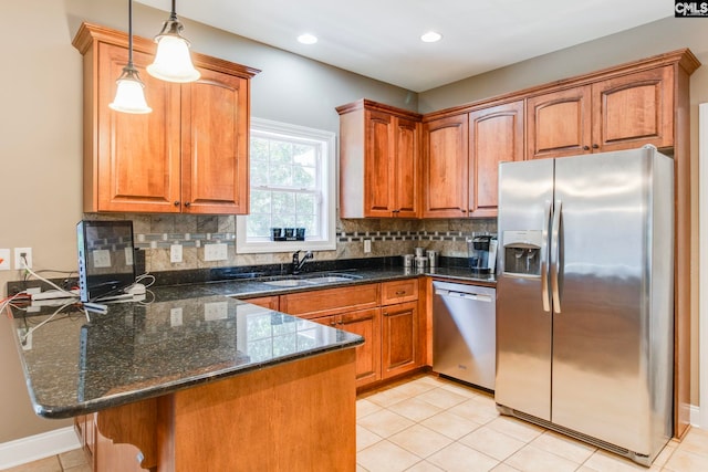 487 Marsh Pointe Dr, Columbia, SC 29229 - kitchen featuring appliances with stainless steel finishes, a peninsula, brown cabinets, decorative light fixtures, and recessed lighting