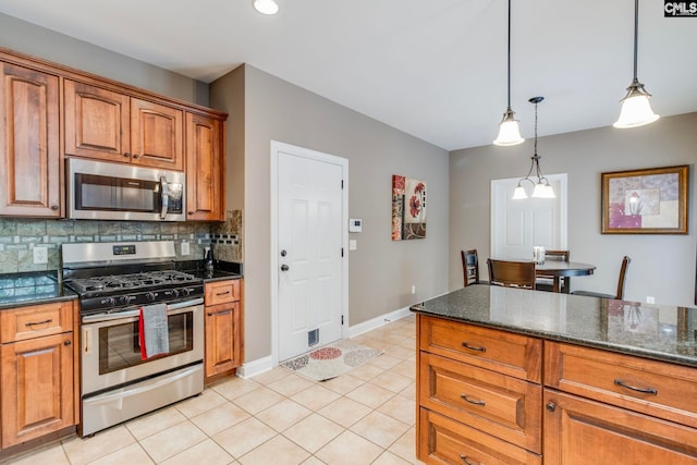 487 Marsh Pointe Dr, Columbia, SC 29229 - kitchen featuring appliances with stainless steel finishes, brown cabinetry, light tile patterned floors, decorative light fixtures, and decorative backsplash