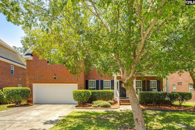 487 Marsh Pointe Dr, Columbia, SC 29229 - view of property hidden behind natural elements featuring brick siding, driveway, an attached garage, and a front yard