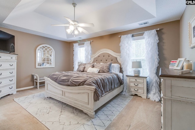 487 Marsh Pointe Dr, Columbia, SC 29229 - bedroom featuring a raised ceiling, light carpet, and a ceiling fan