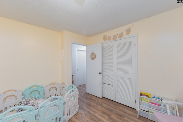 131 Firebranch St, Columbia, SC 29212 - bedroom featuring wood finished floors, a closet, and a textured ceiling
