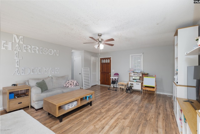 131 Firebranch St, Columbia, SC 29212 - living room featuring ceiling fan, wood finished floors, and a textured ceiling