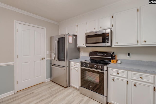 112 Pebble Place Ct, Lexington, SC 29072 - kitchen with stainless steel appliances, light wood finished floors, ornamental molding, white cabinets, and light countertops