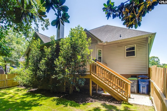 112 Pebble Place Ct, Lexington, SC 29072 - back of house featuring a shingled roof, stairs, a deck, and a chimney
