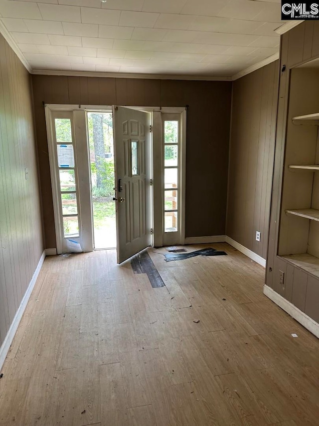 2601 Myrtle St, Newberry, SC 29108 - foyer entrance featuring crown molding, hardwood / wood-style floors, wooden walls, and healthy amount of natural light