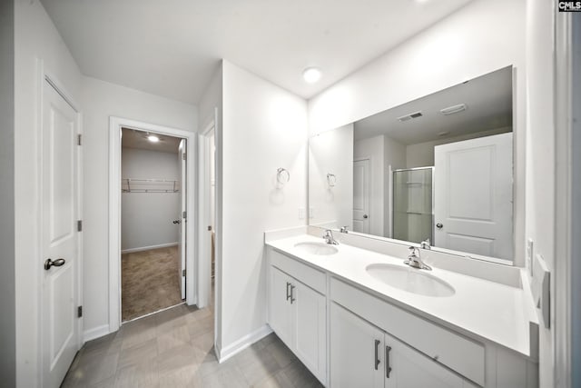 2416 Newberry Landing Cir, Newberry, SC 29108 - bathroom with a stall shower, double vanity, and a walk in closet
