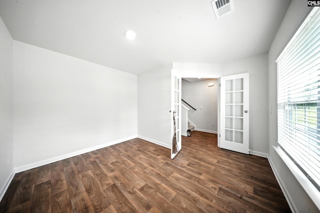 2416 Newberry Landing Cir, Newberry, SC 29108 - unfurnished room featuring dark wood finished floors, stairway, and french doors